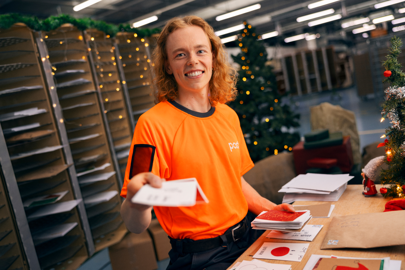 The worker is sorting cards.