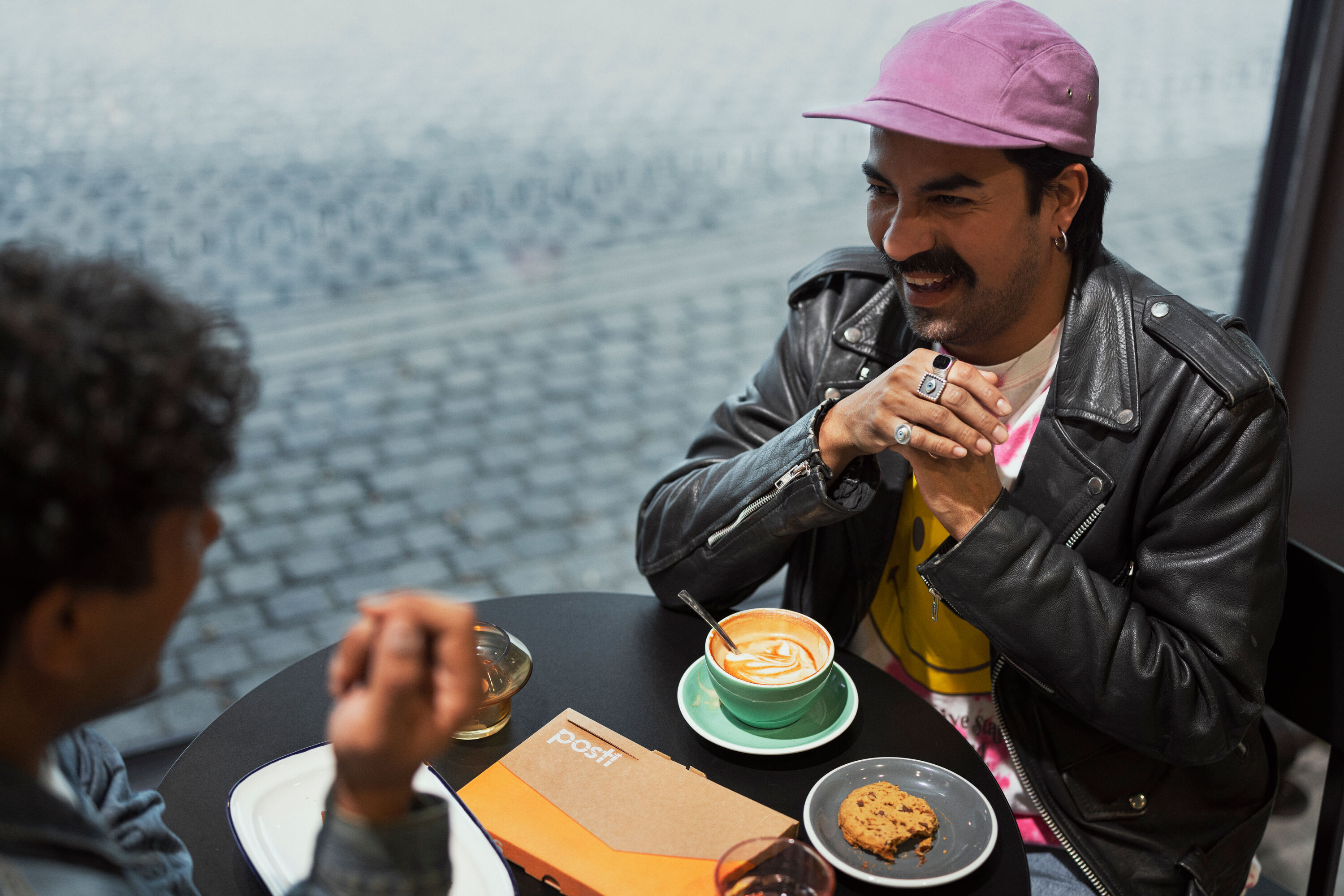 Two people having coffee together.