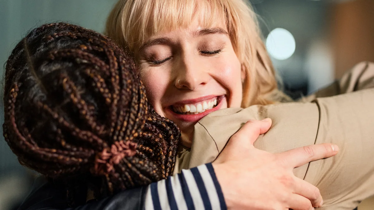 Two people are hugging each other.