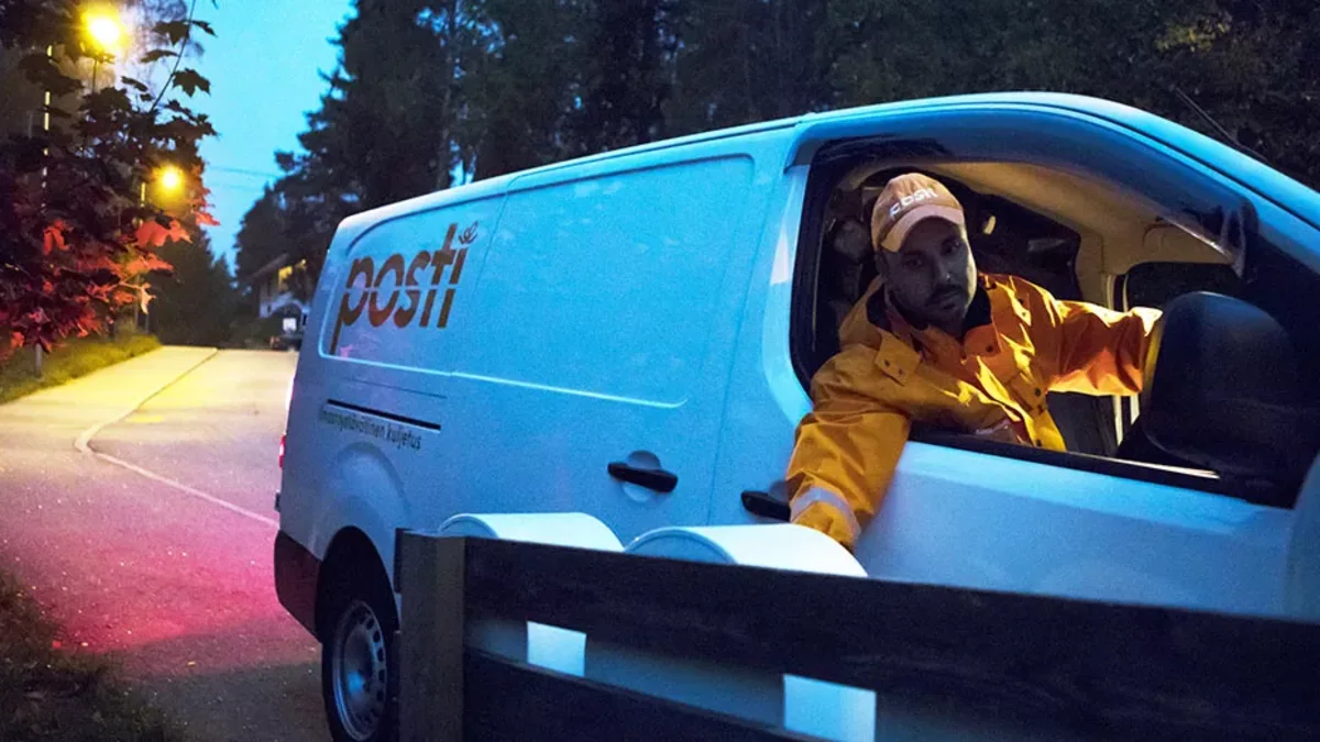 A man delivering mail in early delivery.