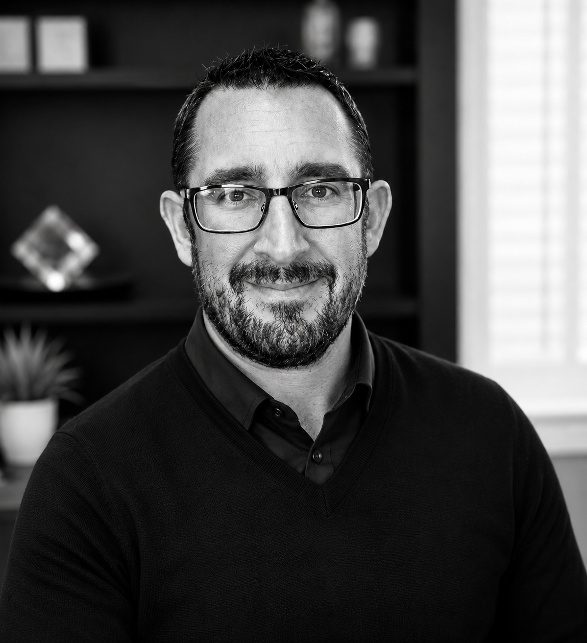 A professional office portrait of Chris Holdsworth, Chief Commercial Officer, TA Connections