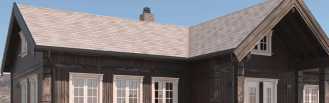Hytte med beito takshingel på taket. Grå shingel med fint mønster på en sort hytte i fint vær.