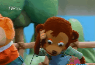 Gif: A monkey puppet looking wide-eyed and confused (Source)