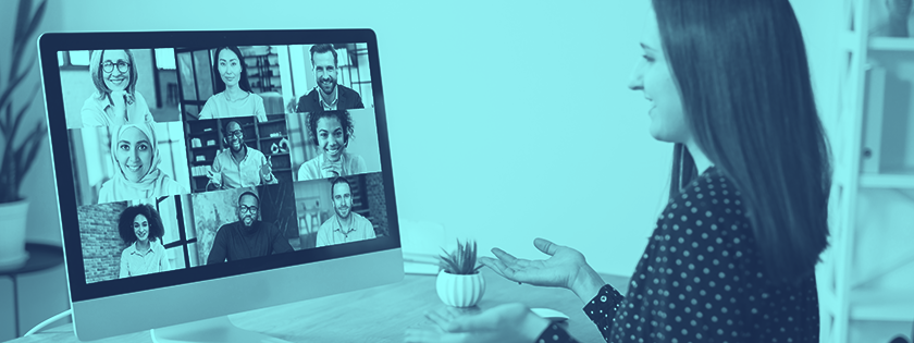 Woman in a polka dot shirt on a video call with diverse people.