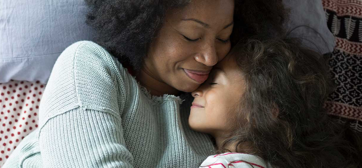 Woman hugging child