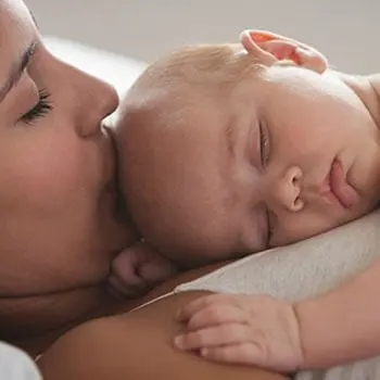 Mom with baby sleeping on chest