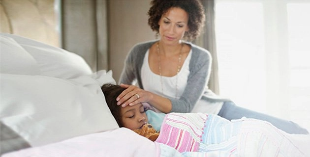 Mother caring for sick child