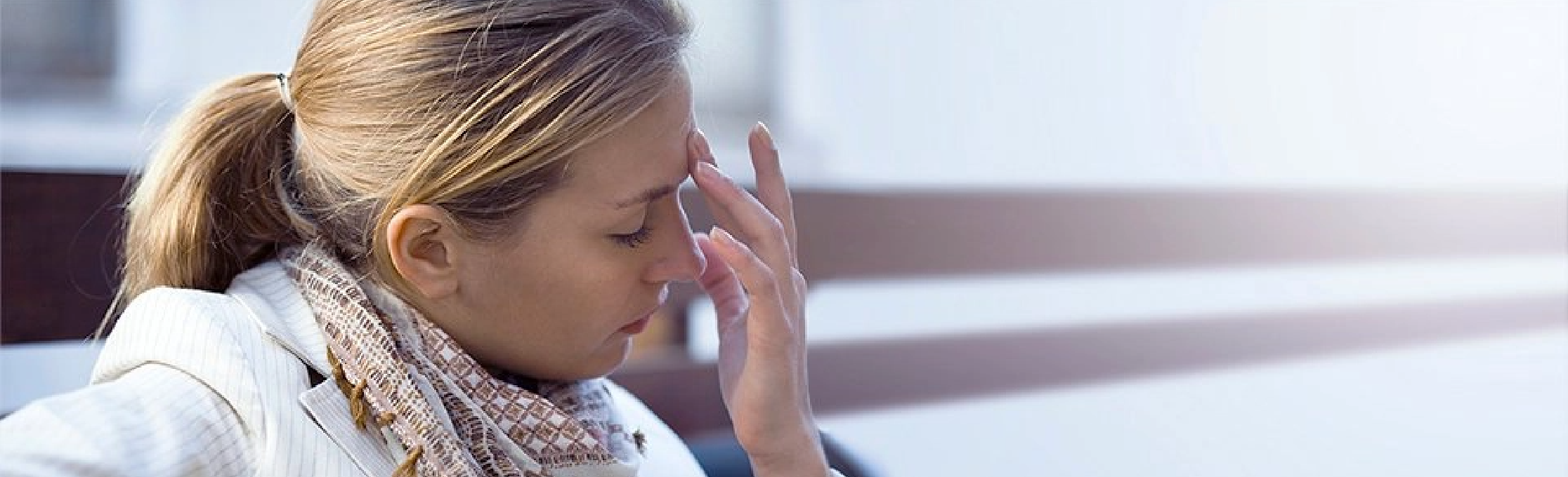 Woman suffering a headache