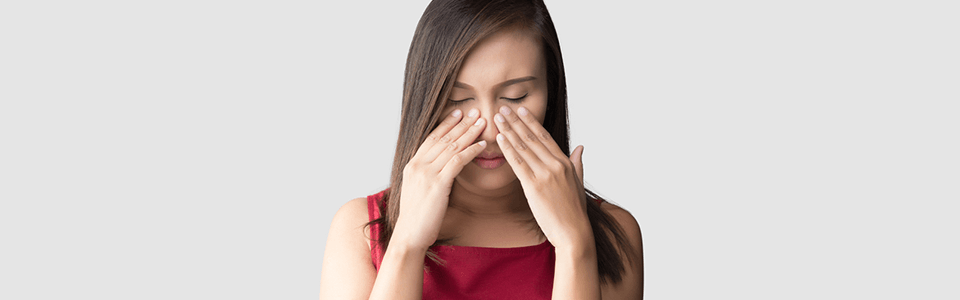 A woman that might have postnasal drip