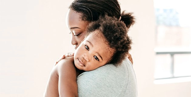 Mother holding her baby