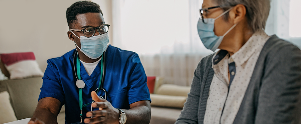 Doctor speaking with his patient