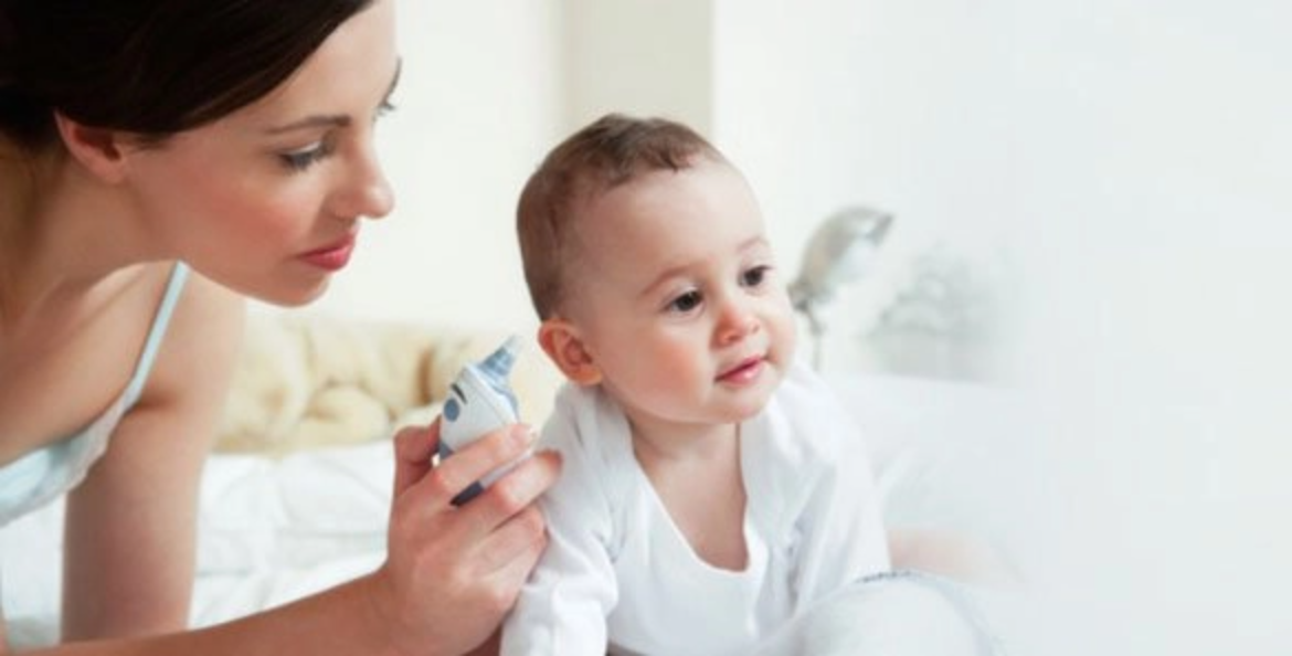 Women treating baby ear infection