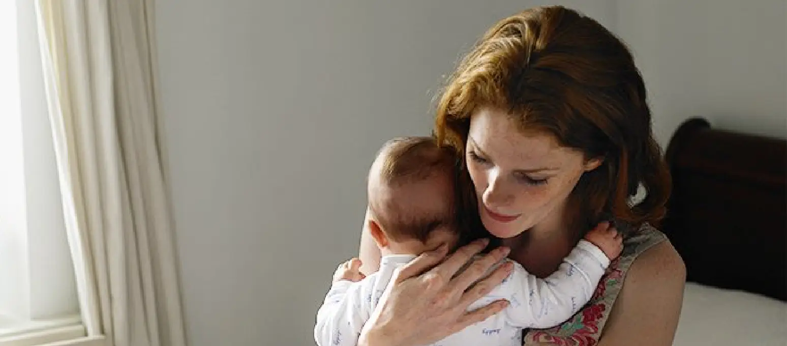 Parent comforting sick baby