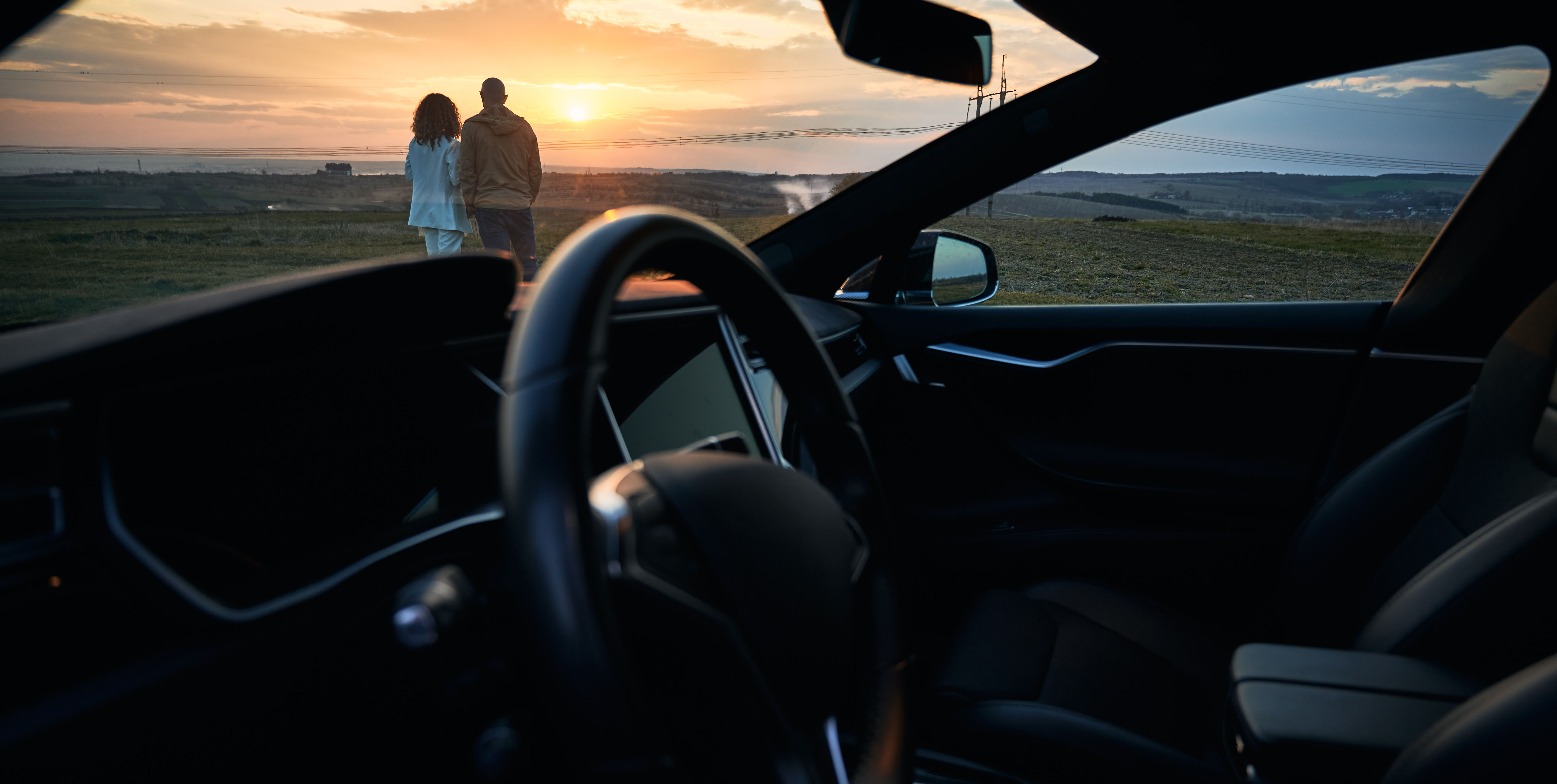 view-from-car-of-young-couple-looking-at-beautiful-2025-01-16-22-17-45-utc