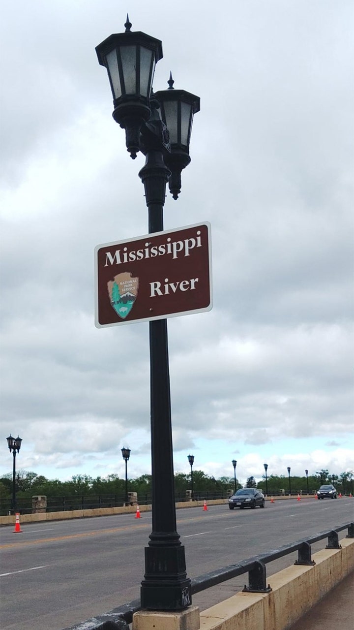 Train derails in Wisconsin near Mississippi River, sending 2 railcars into water