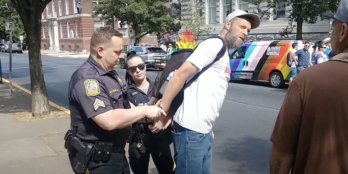 'Sheer tyranny': Man arrested after trying to quote Bible to Pride-rally attendees — who applaud when he's put in handcuffs