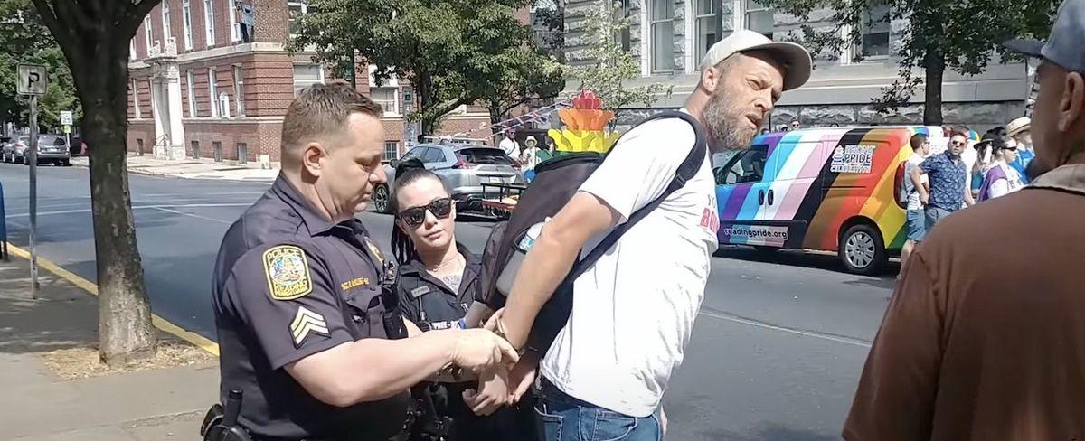 'Sheer tyranny': Man arrested after trying to quote Bible to Pride-rally attendees — who applaud when he's put in handcuffs