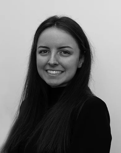 a black and white photo of Jessica Pinches in smart business attire.