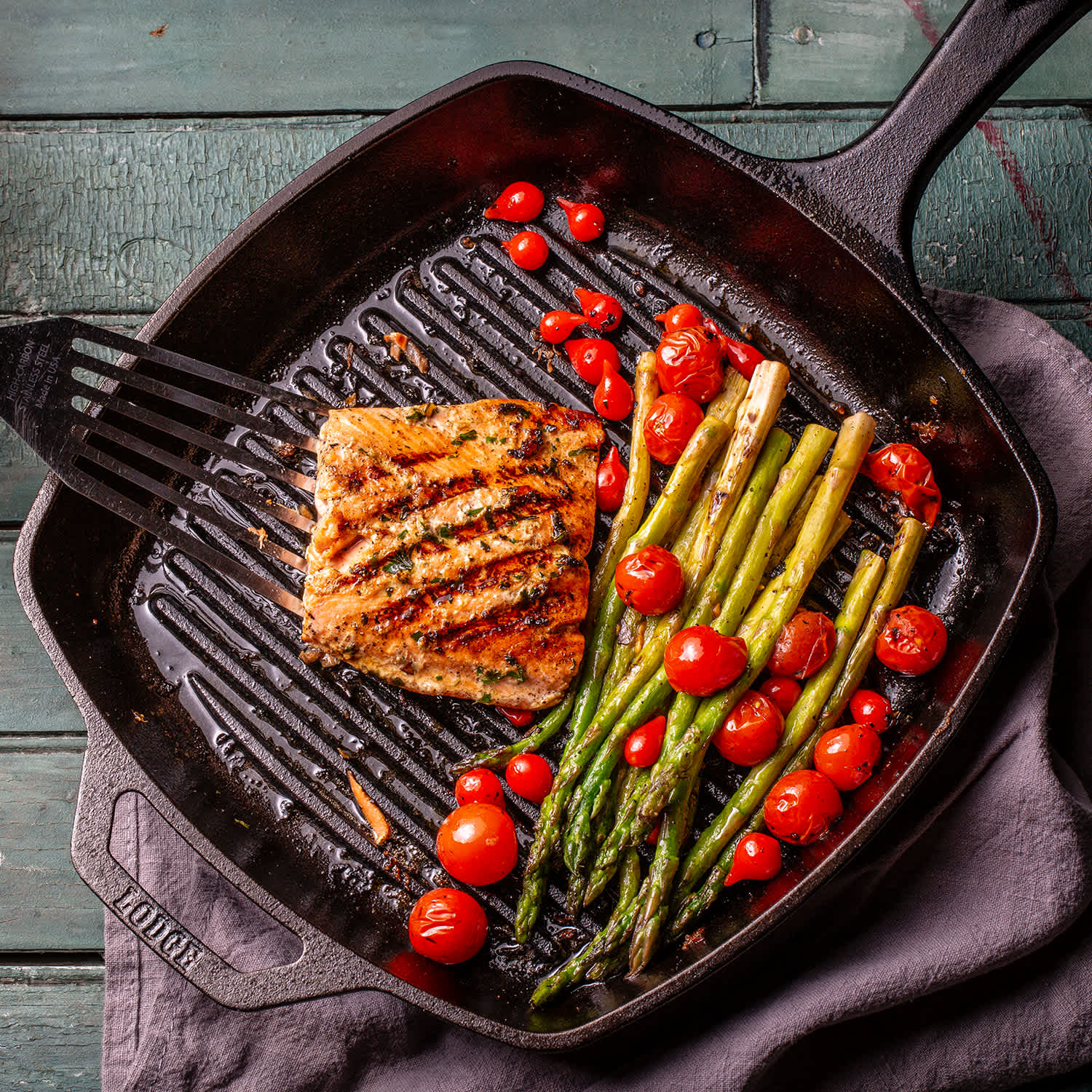 salmon and vegetables in cast iron skillet