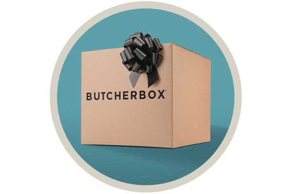 A cardboard box with the butcherbox brand name and black gift bow