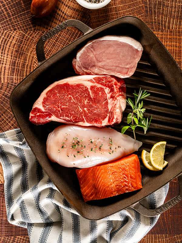 Raw meat and seafood in pan