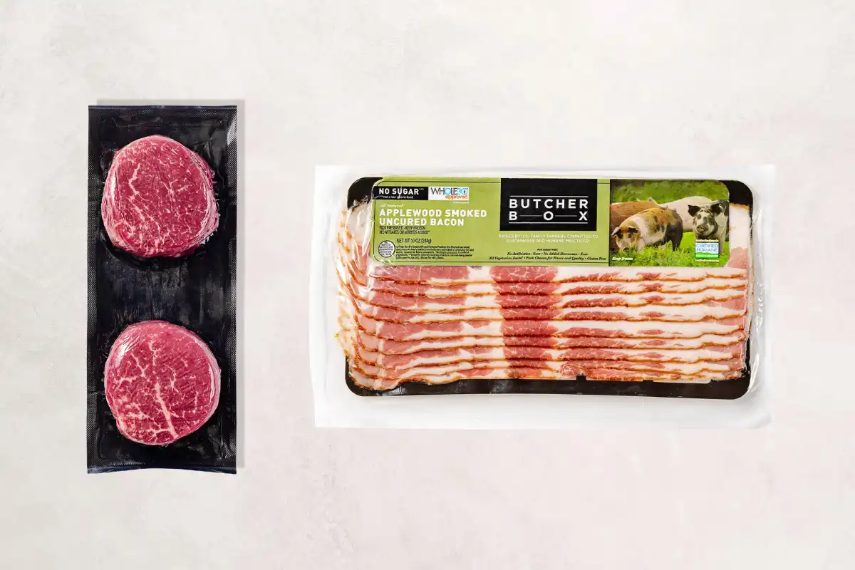 Packaged filet mignons and bacon on a beige background