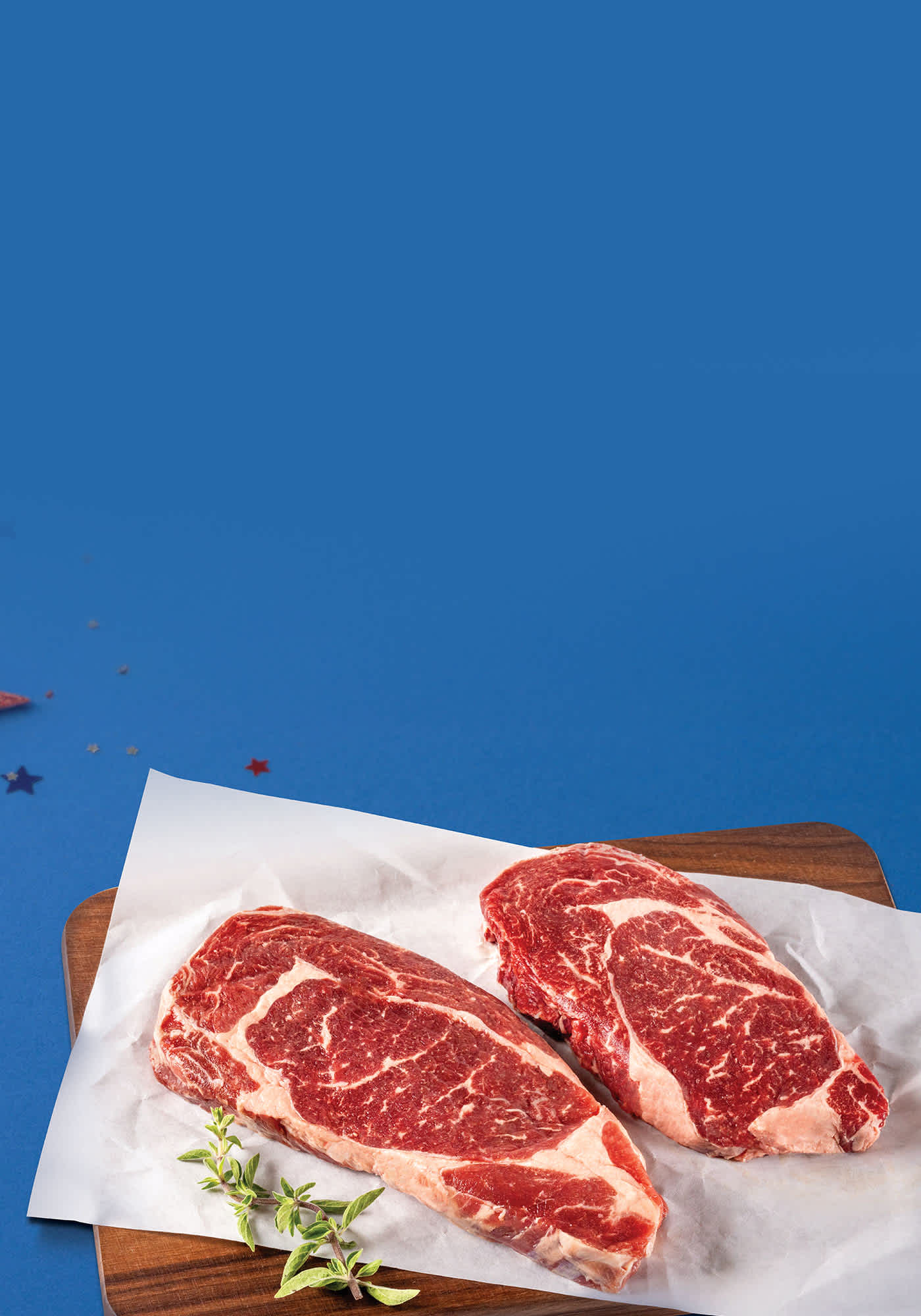 Ribeyes on blue background