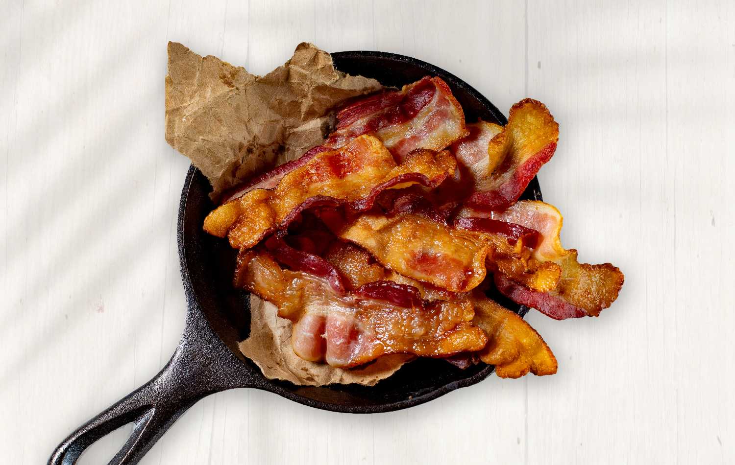 cooked bacon in cast iron pan