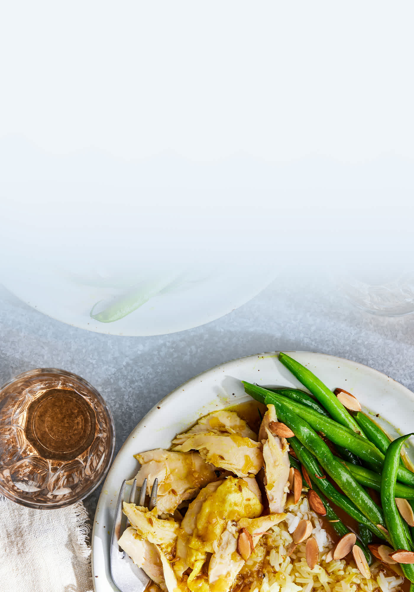 A plate of cooked chicken and vegetables