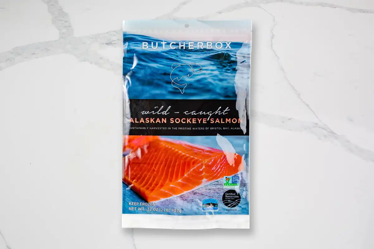 Packaged salmon on marble background