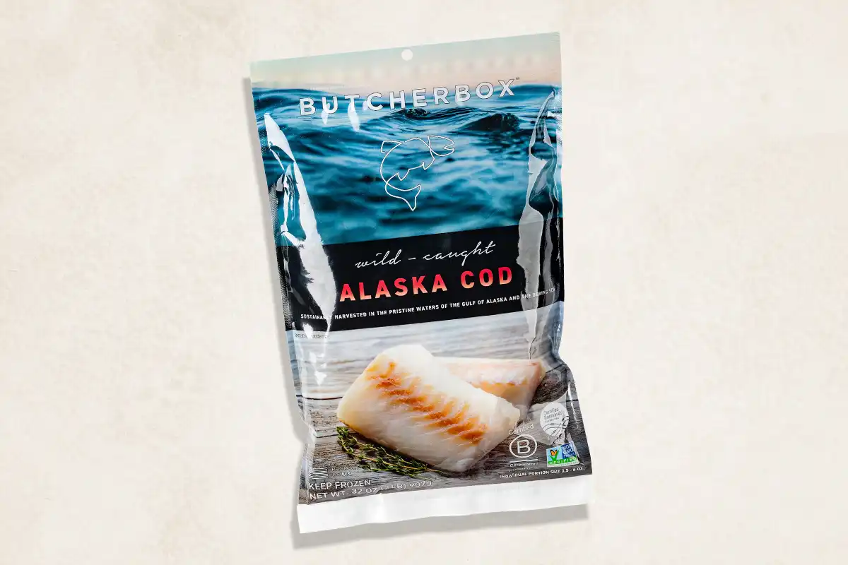 Packaged cod on beige background