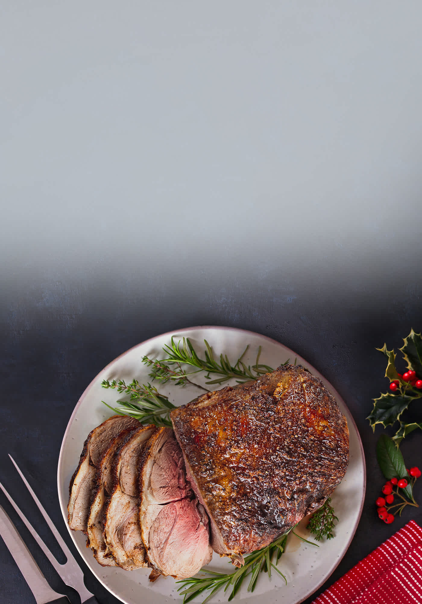 A holiday roast on a festive plate with a blue background.