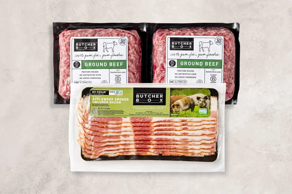 Ground beef and bacon on beige background