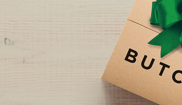 Two ButcherBox boxes with green ribbons