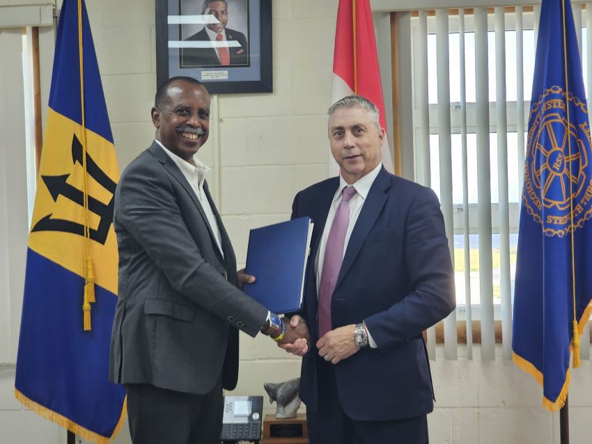 RSS Executive Director Rear Admiral Errington Shurland and RCMP Regional Director for Latin America and the Caribbean Brian Moreau sign the Memorandum of Understanding. 