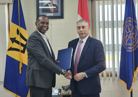 RSS Executive Director Rear Admiral Errington Shurland and RCMP Regional Director for Latin America and the Caribbean Brian Moreau sign the Memorandum of Understanding.