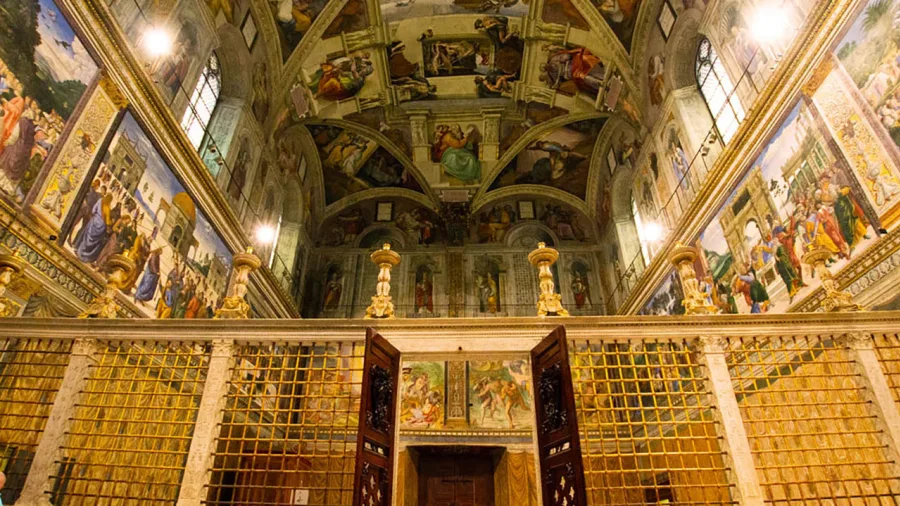 Visit the Sistine Chapel at night.