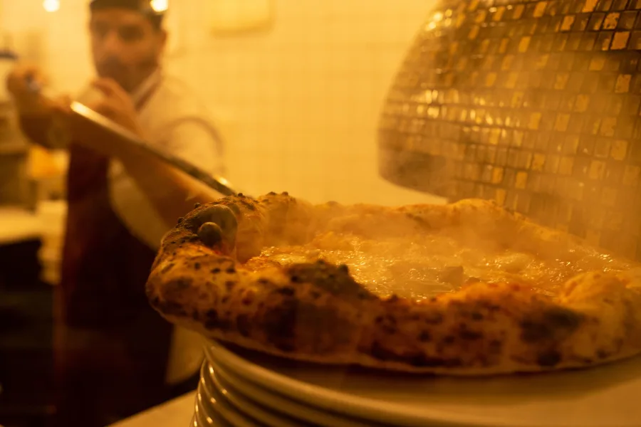 Step into the kitchens of Naples’ most beloved pizzerias.