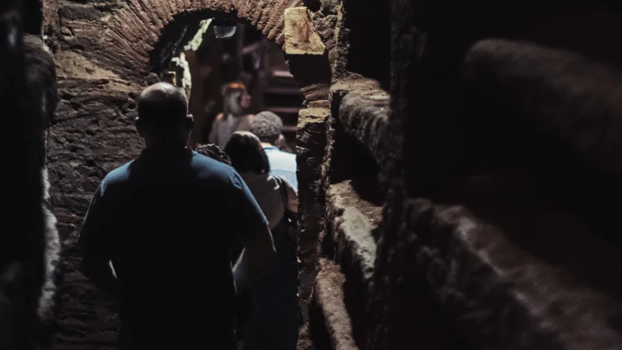 Explore the dark underground of Rome's Catacombs.