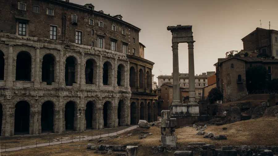 Start your Colosseum night tour at the Teatro di Marcello as evening falls over Rome.