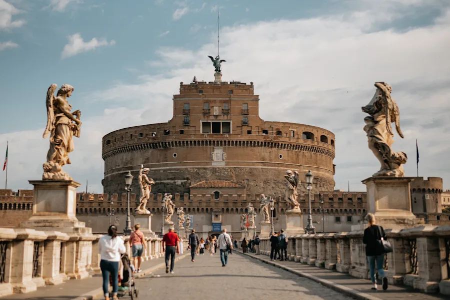 Walk across the Ponte Sant'Angelo to the imposing Castel Sant'Angelo.