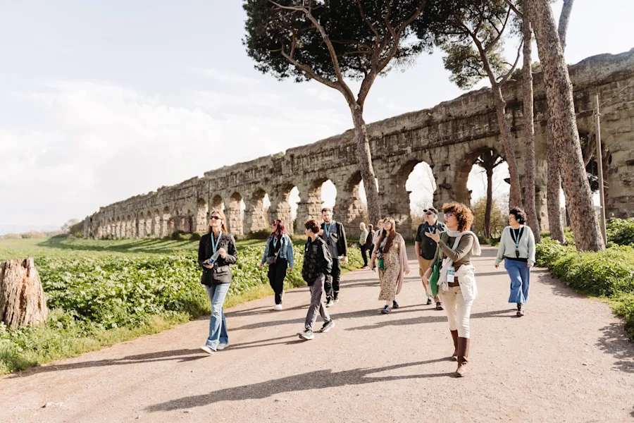 Stand beneath the towering Roman aqueducts