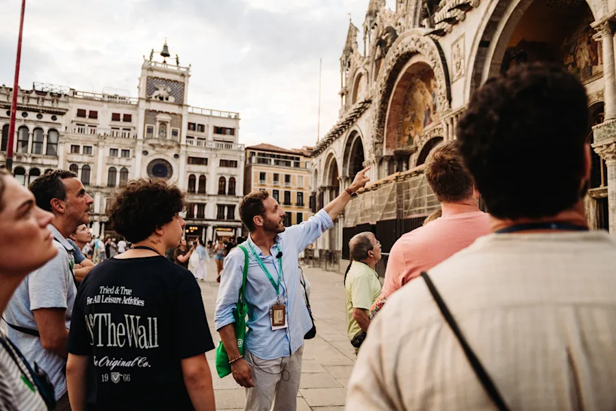 Pause outside St. Mark's Basilica.