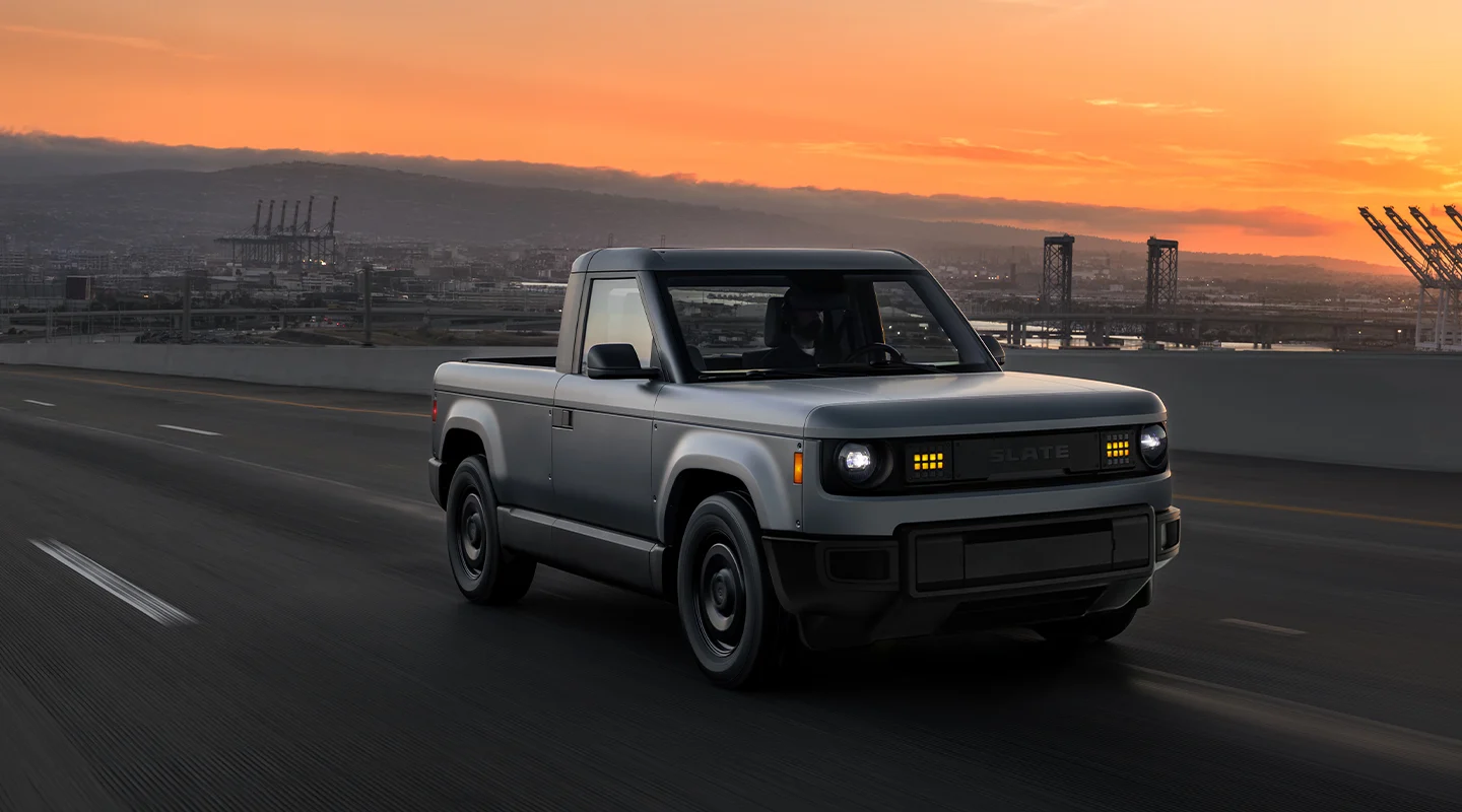 Dusk image of truck driving in suburban city