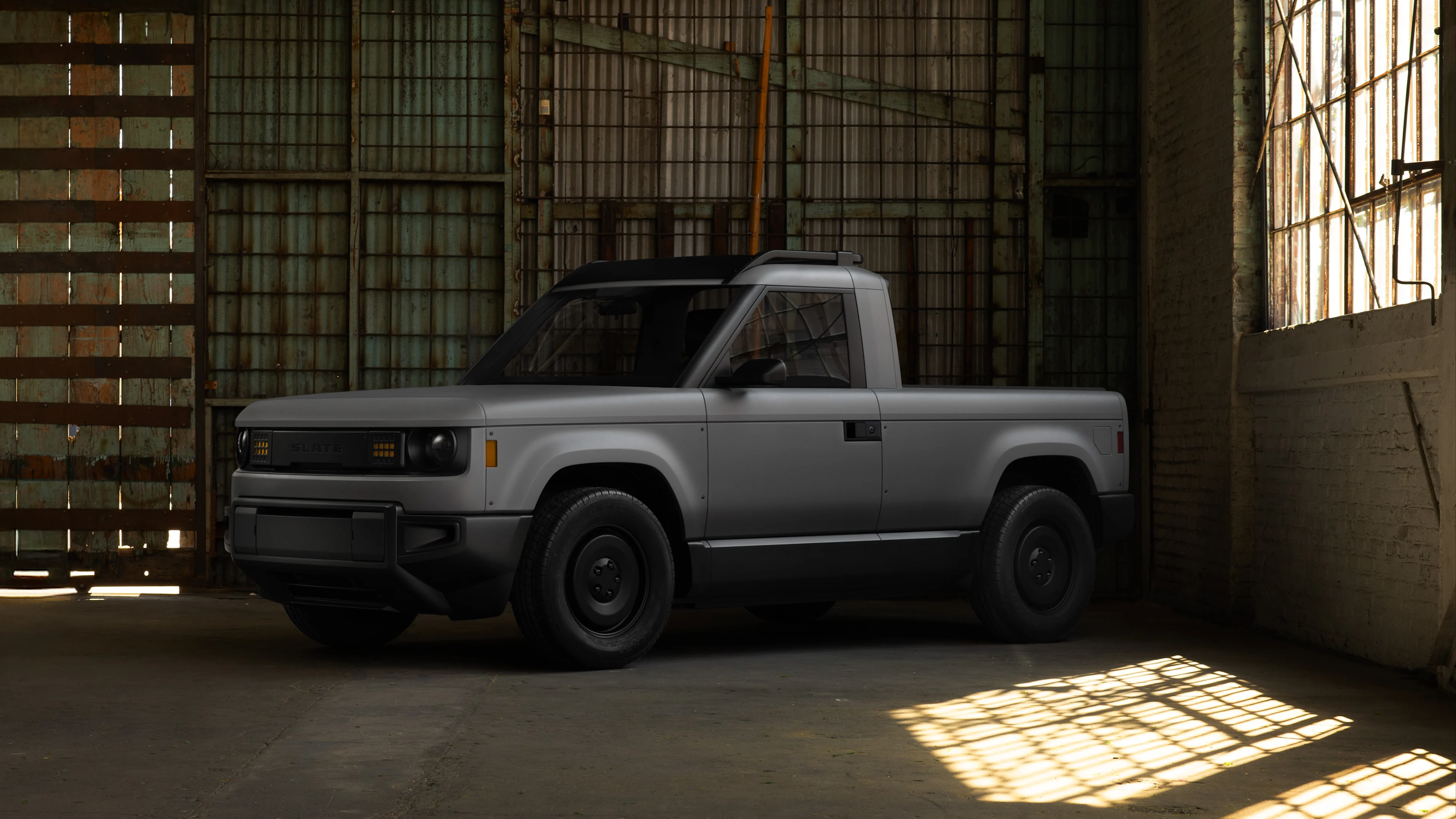 Blank Slate in front of factory windows