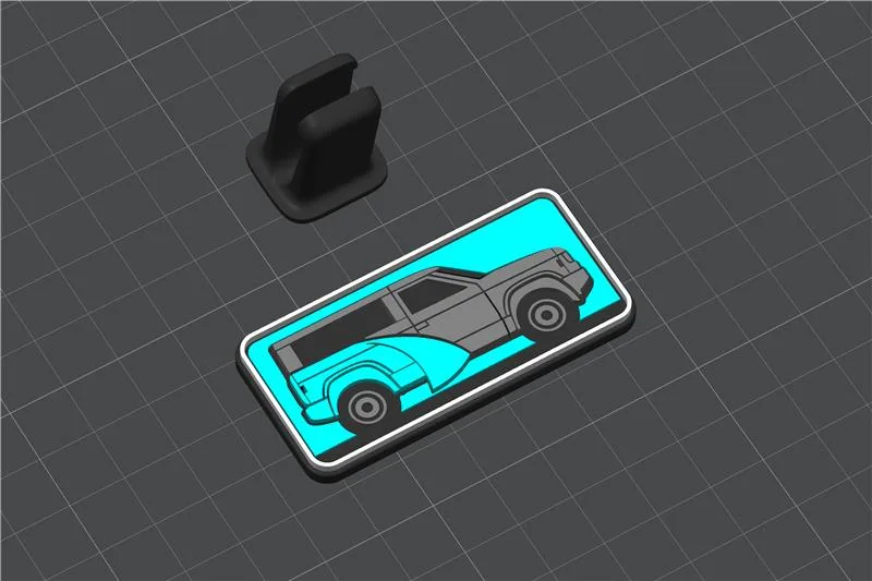plastic badge with image of Slate wrapped in teal