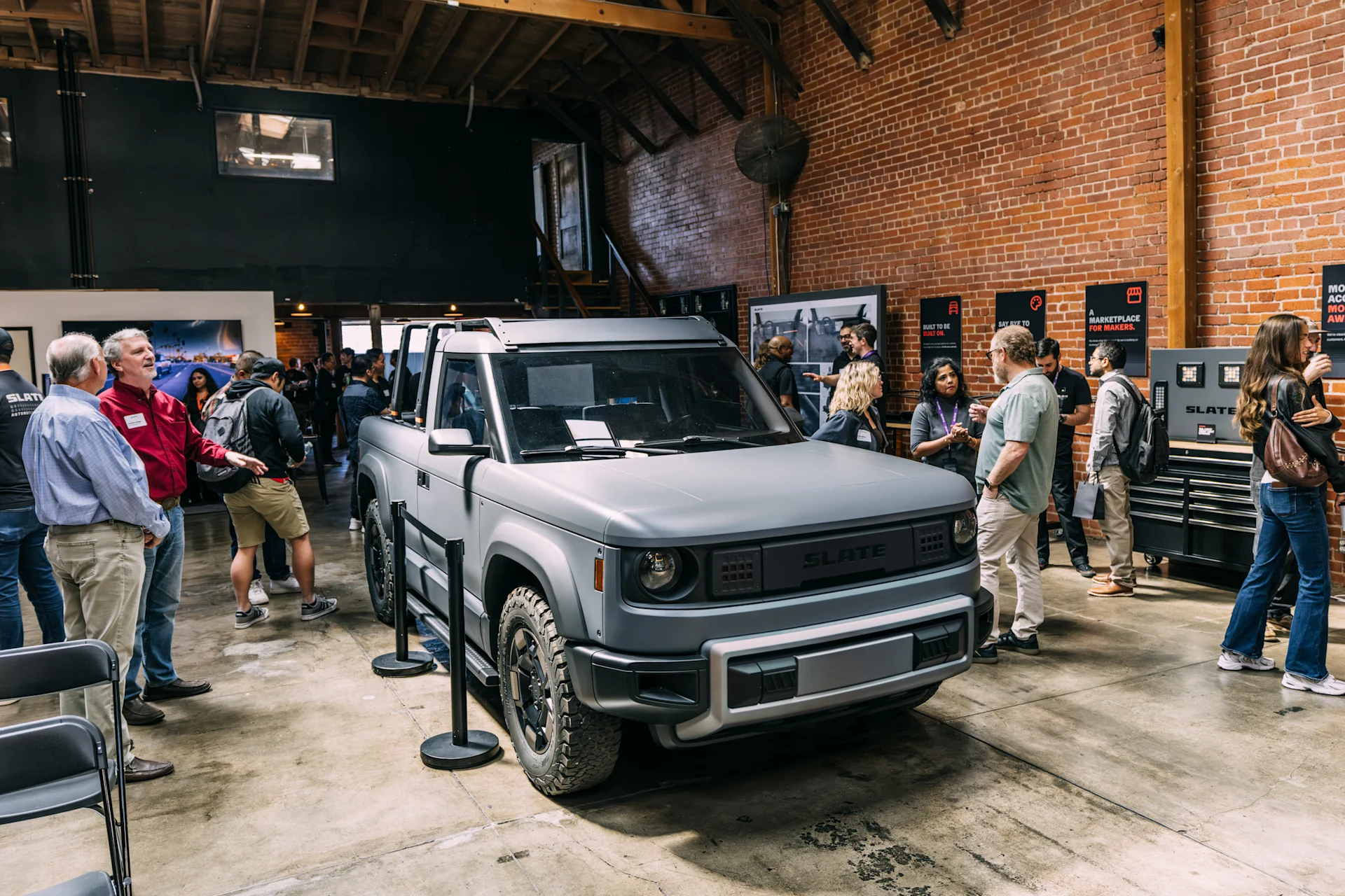 People gathered around the Slate Truck at maker event.