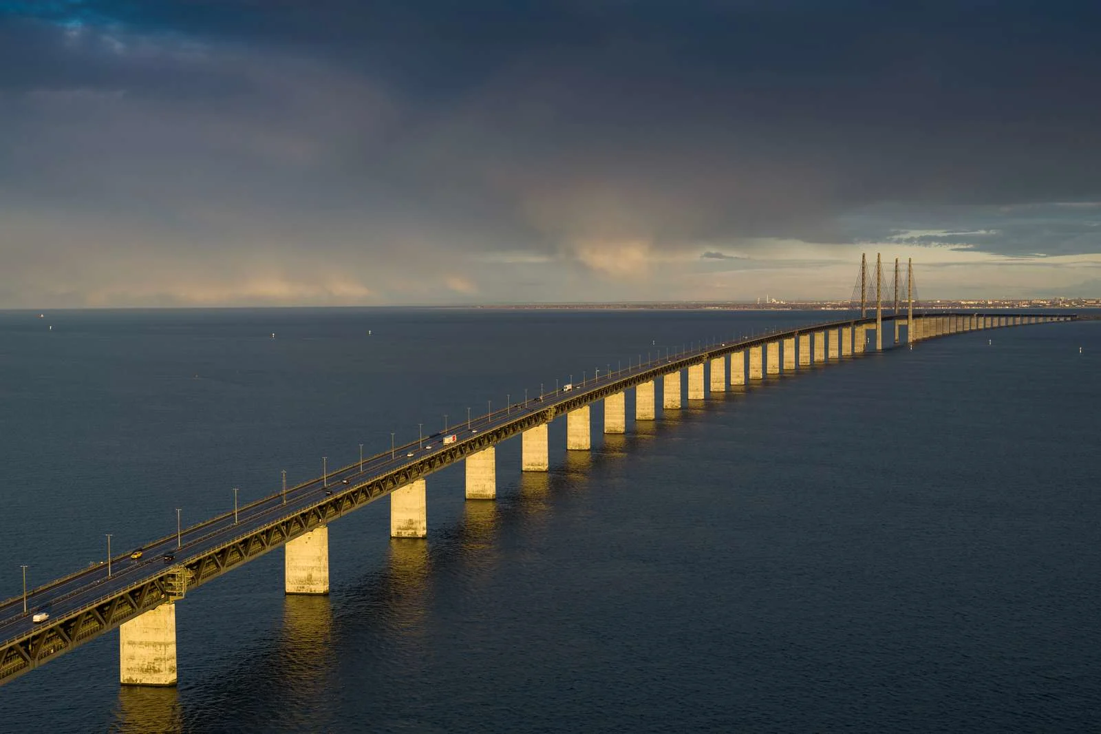 Drone image of the Øresund Bridge with a touch of sunlight