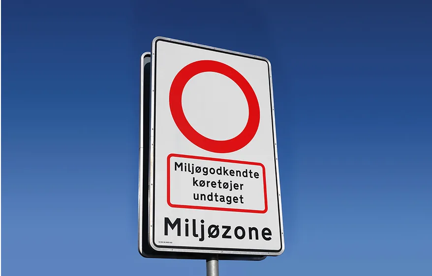Danish environmental zone sign marking the entrance to environmental zones. The sign has a white background, black text and border, and a red circle to indicate the zone.  