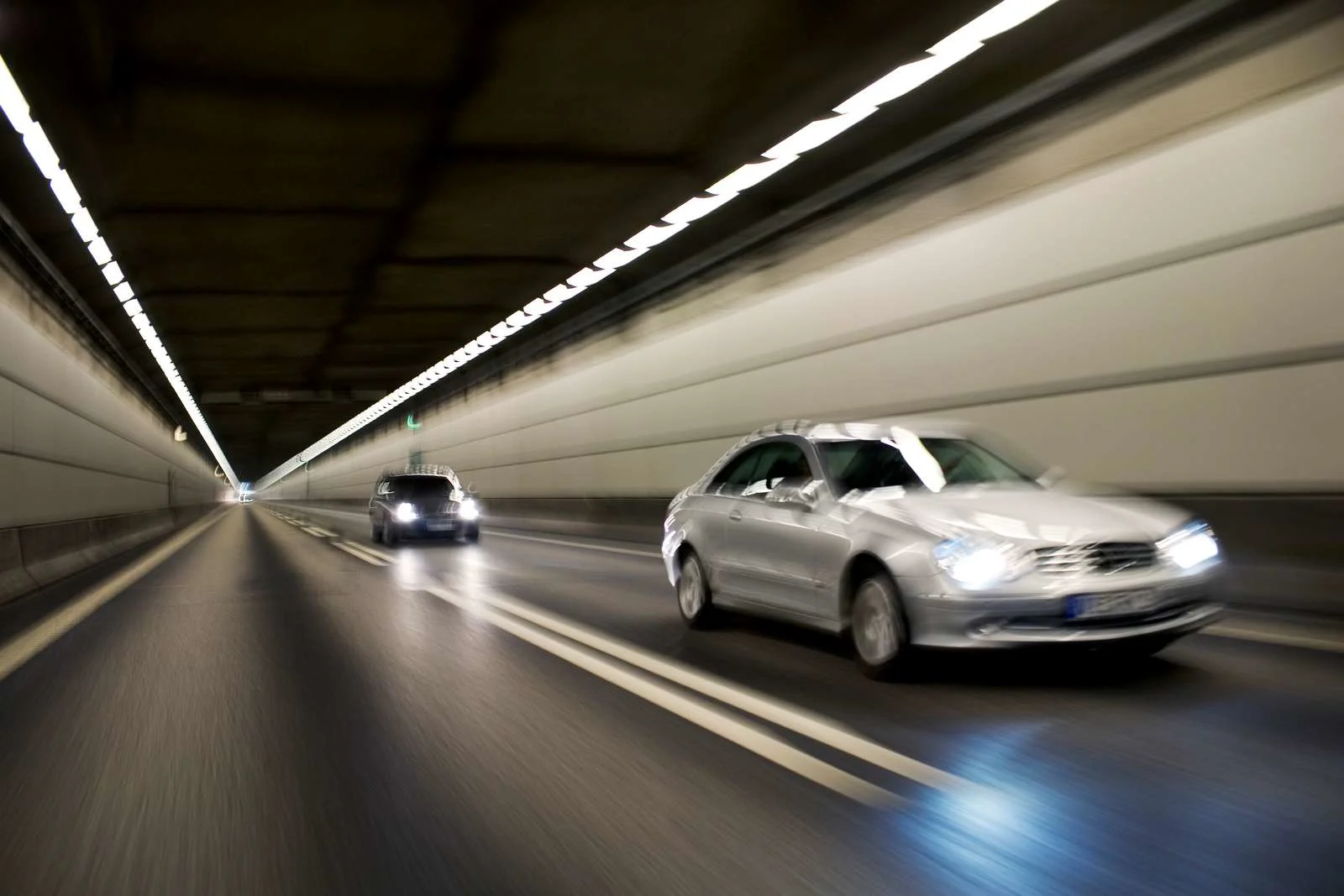 Cars drive through the tunnel connecting the Øresund Bridge underwater